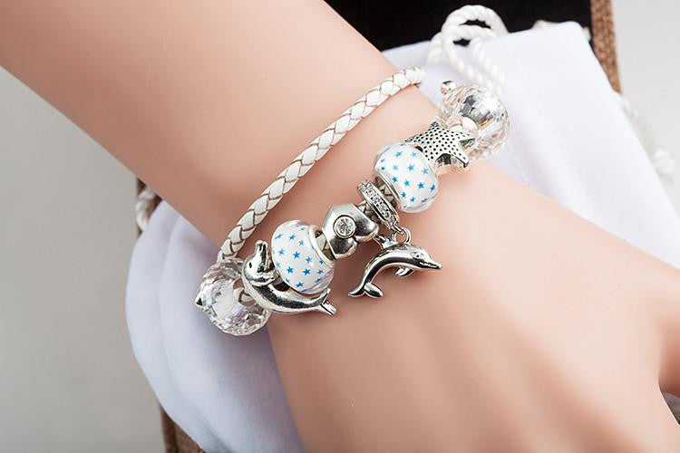 DOLPHINS CHARM BRACELET WHITE LEATHER "2" - WikiWii